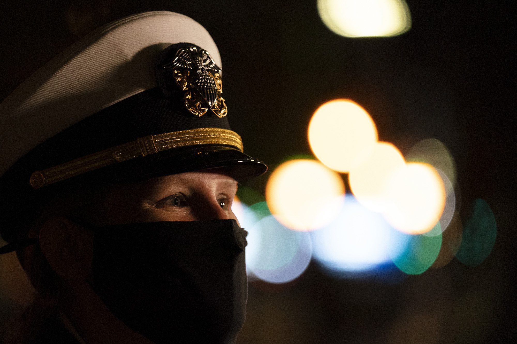 A Navy officer joins in a wreath-laying ceremony at the Eternal Light Flagstaff in Madison Square Park, Wednesday, Nov. 11, 2020, in New York.