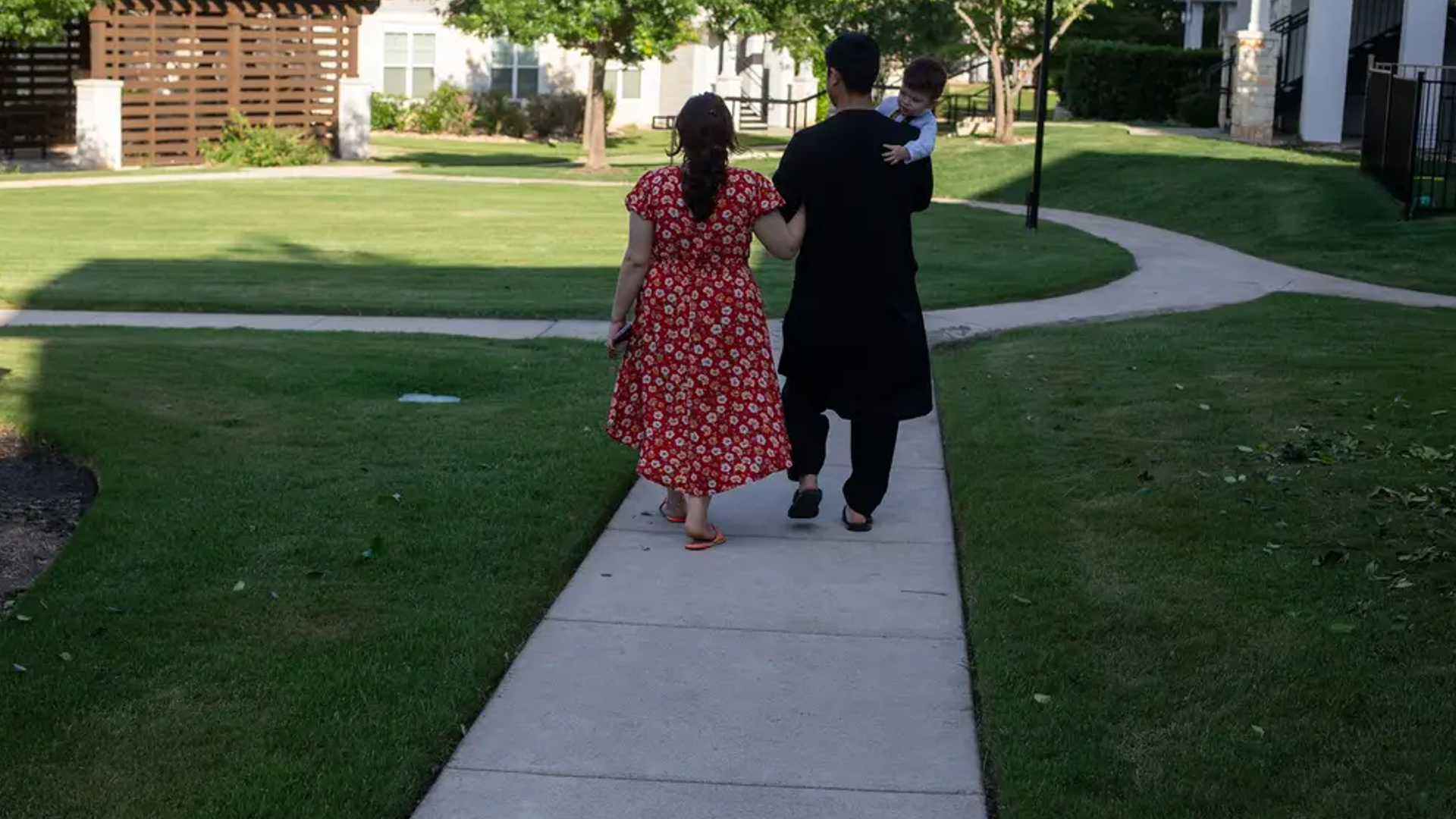 Jawady, Sadra and Qmars outside their Austin home.